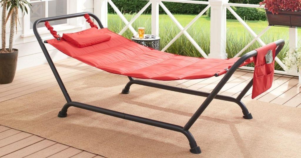 red hammock on stand on porch