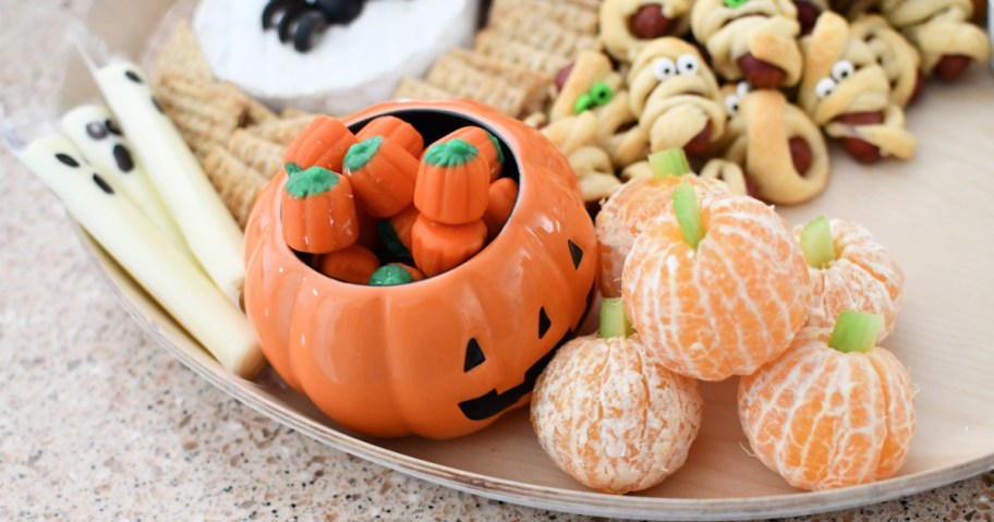 pumpkin with candy corn and mandarin orange pumpkins