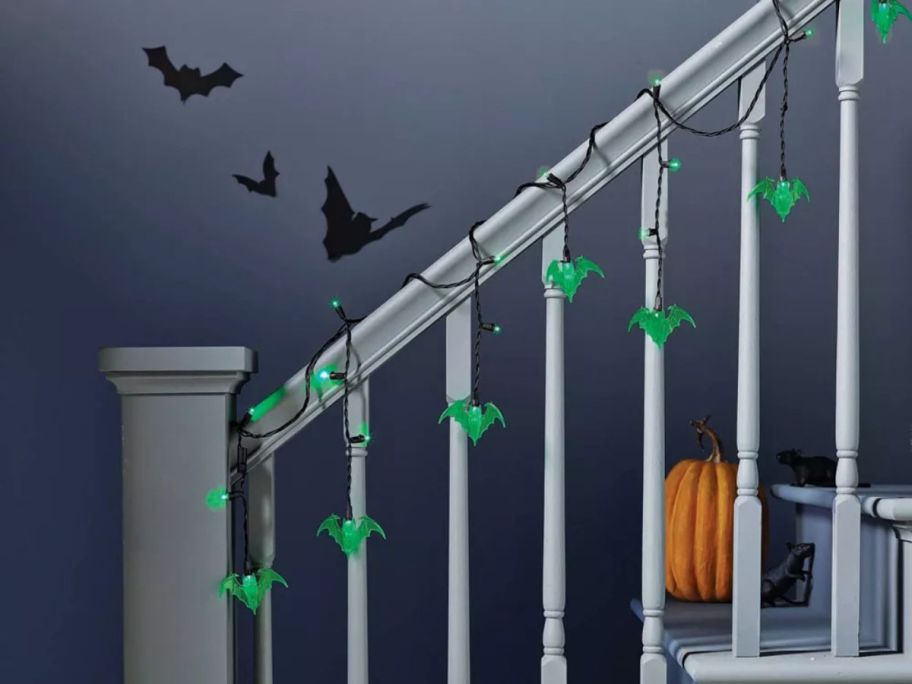 green bat string lights on stairs