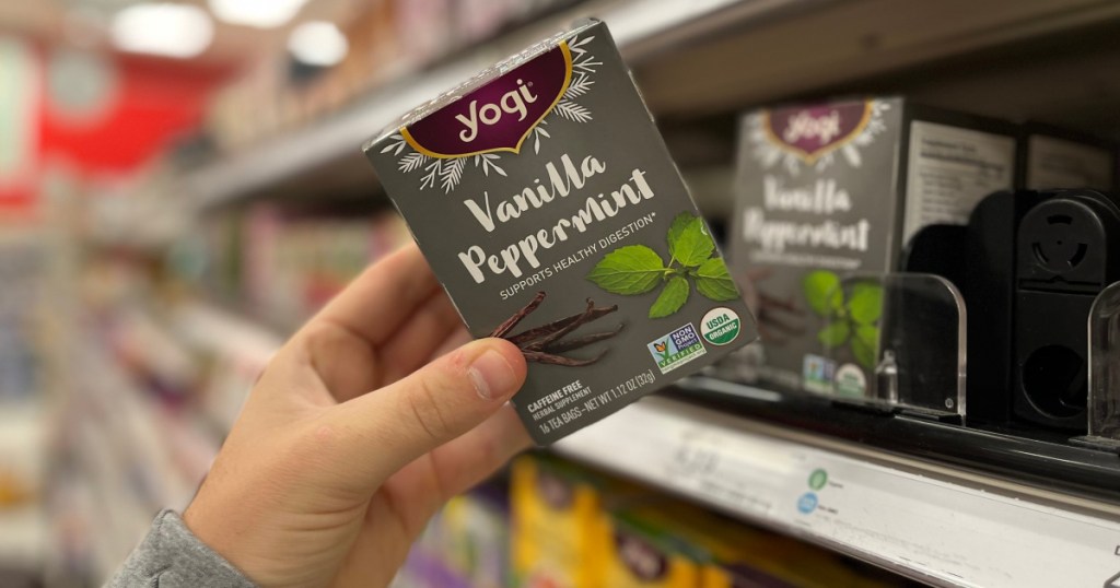 hand grabbing yogi teas on shelf