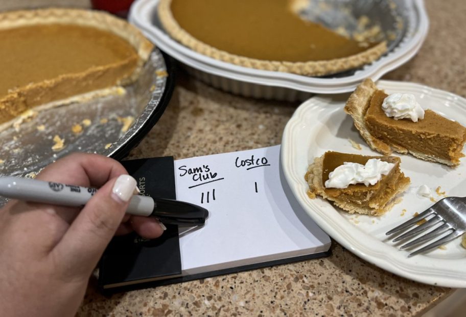 Hand marking down the winner of the Costco vs. Sam's Club Pumpkin Pie Taste Test