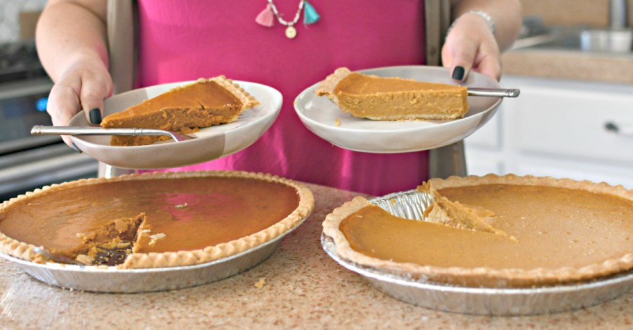 holding out slices of Costco vs. Sam's Pumpkin Pie