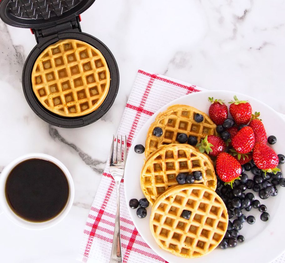 waffle maker and plate of mini waffles