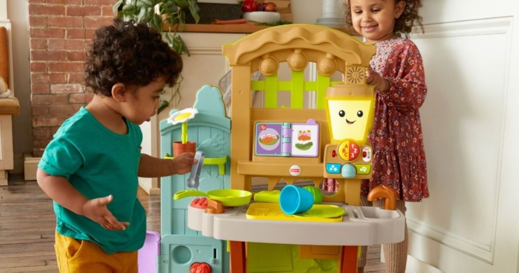 kids playing with a kitchen set