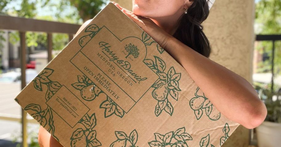 Woman holding a harry & David Gift Box