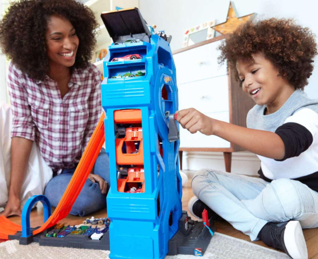 boy playing with a Hot Wheels set