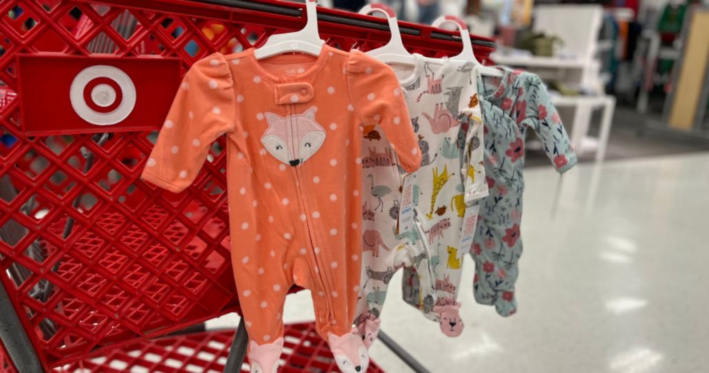 baby footed pajamas hanging on cart