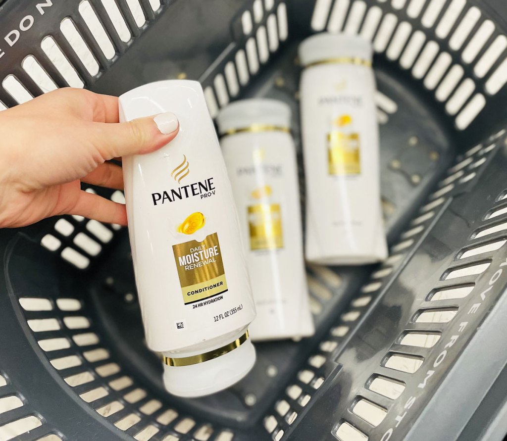 placing pantene conditioner in basket