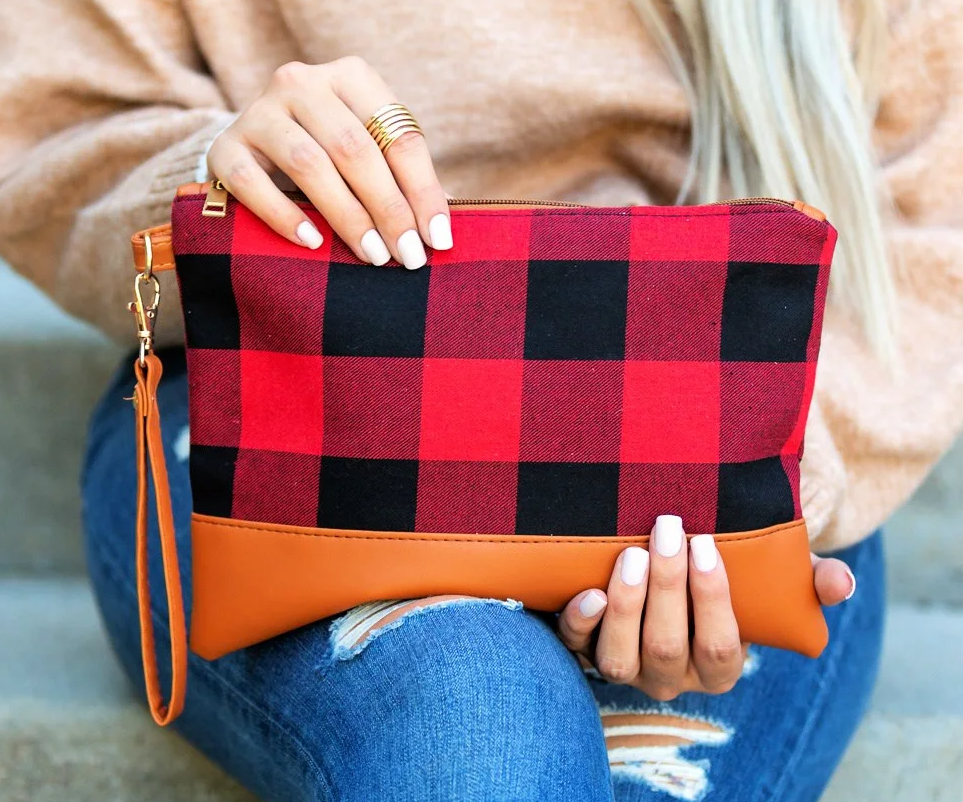 woman holding a clutch