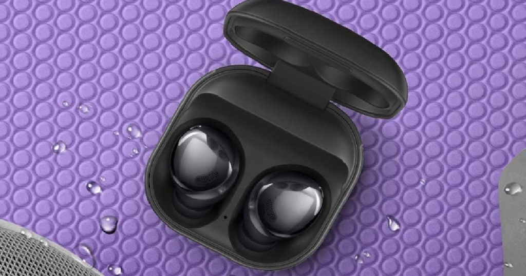 black earbuds on purple sheet 