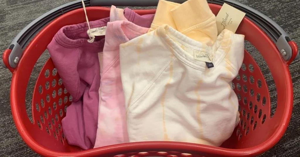 various sweatshirts in red basket 