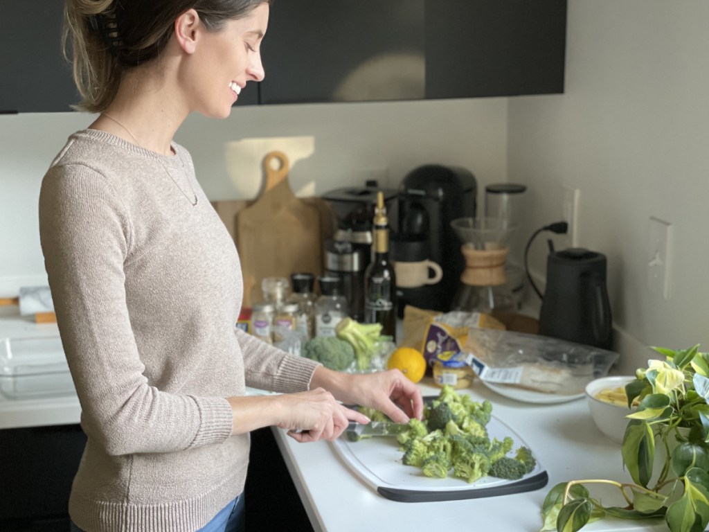 Woman chopping veggies for supper