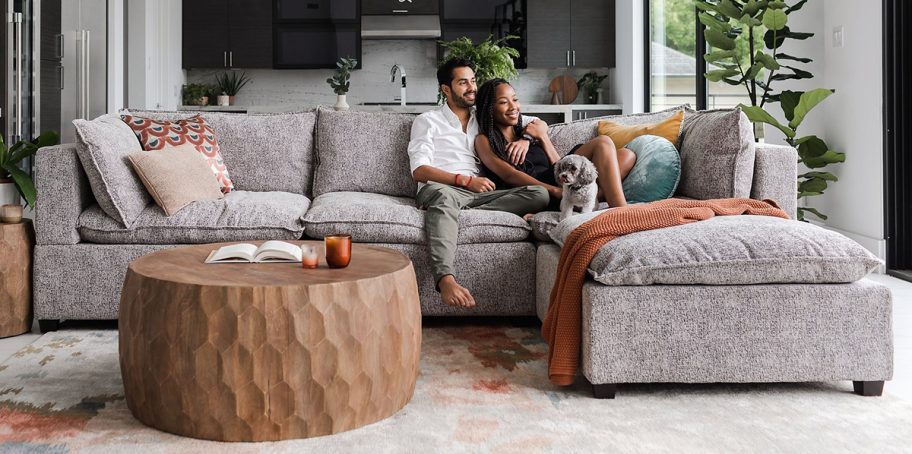 couple sitting on albany park kova sectional