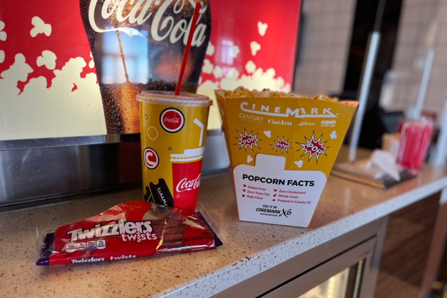 popcorn, sode, and Twizzlers on concession counter