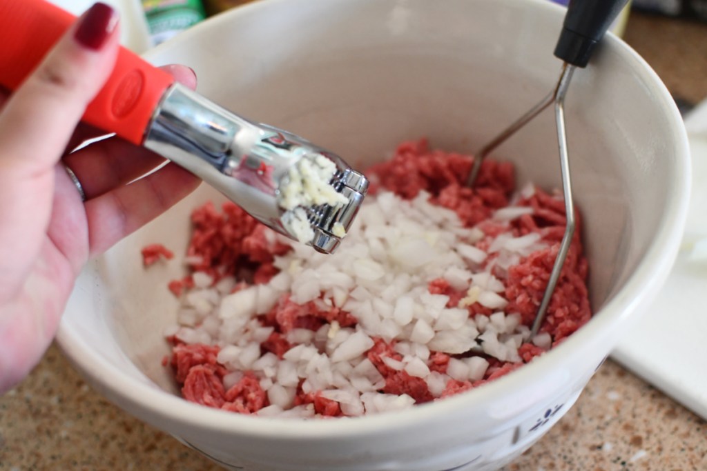 mincing garlic into ground mix