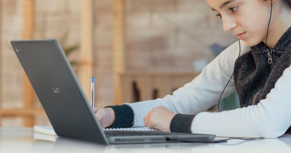 girl looking at a laptop