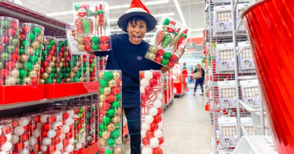 woman holding ashland shatterproof ornaments in store