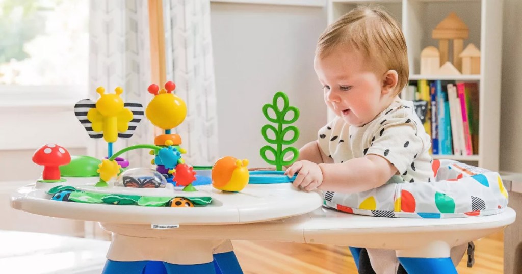 baby in activity center 