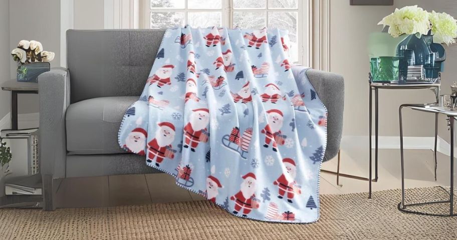 Birch Trail Holiday Printed Fleece Throw Blanket on couch