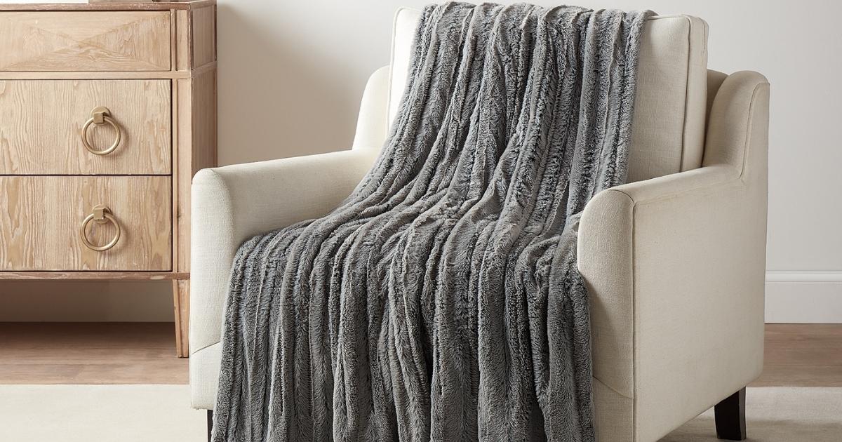 brookstone heated throw blanket draped over chair