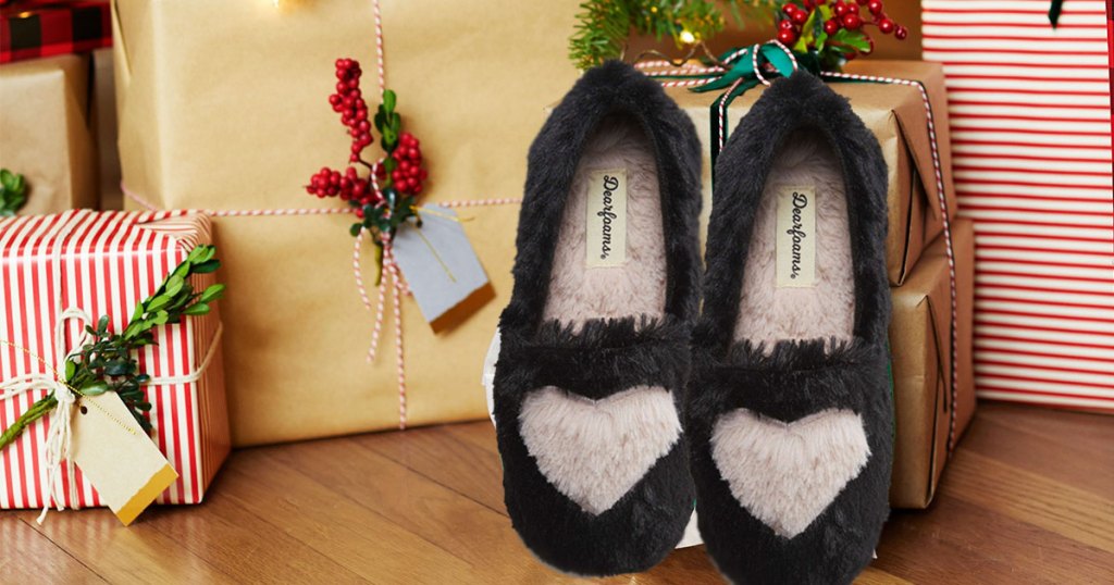 black slippers next to christmas gifts