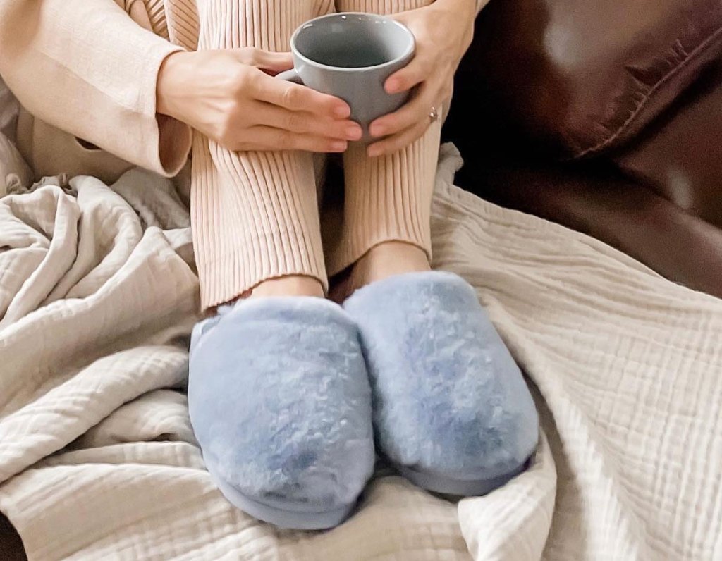 woman wearing blue slippers