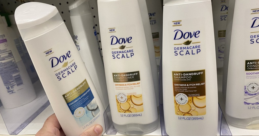 hand grabbing shampoo of shelf 