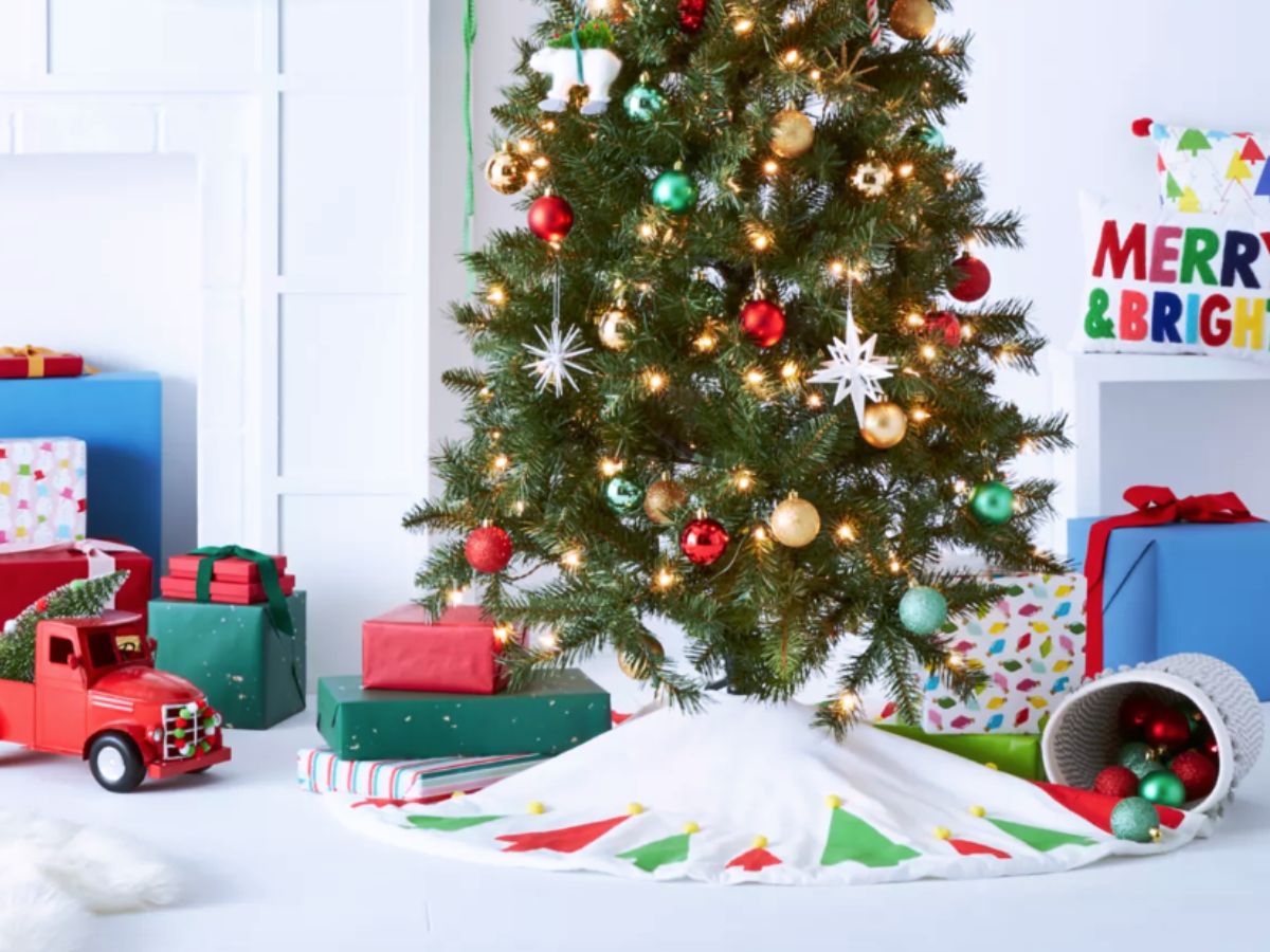 Christmas tree scene with toy truck and gifts underneath