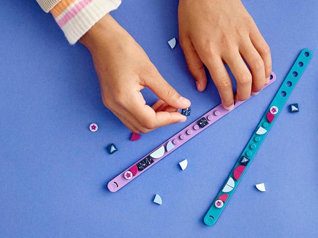 child playing with lego dots diy craft bracelets