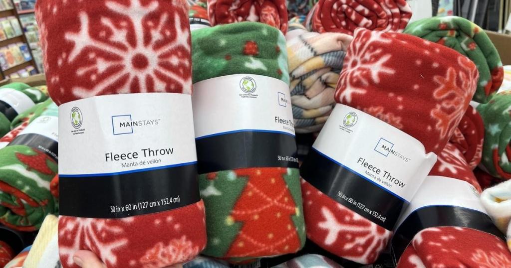 three mainstays fleece throws in store