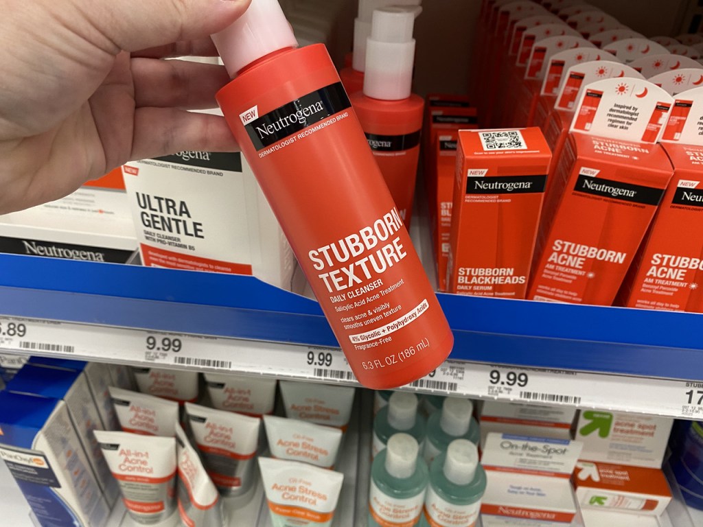 hand holding Neutrogena Stubborn Texture