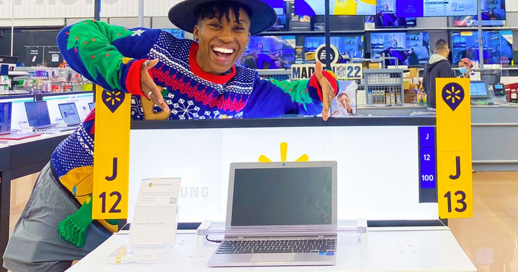 woman pointing at chromebook on display