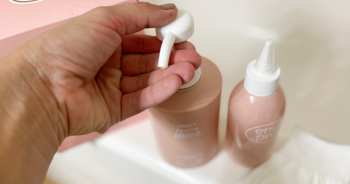 Woman using a pump bottle of shampoo