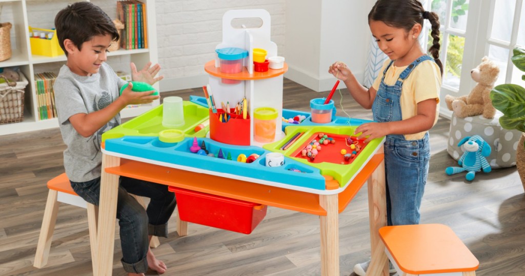 kids playing an an art station