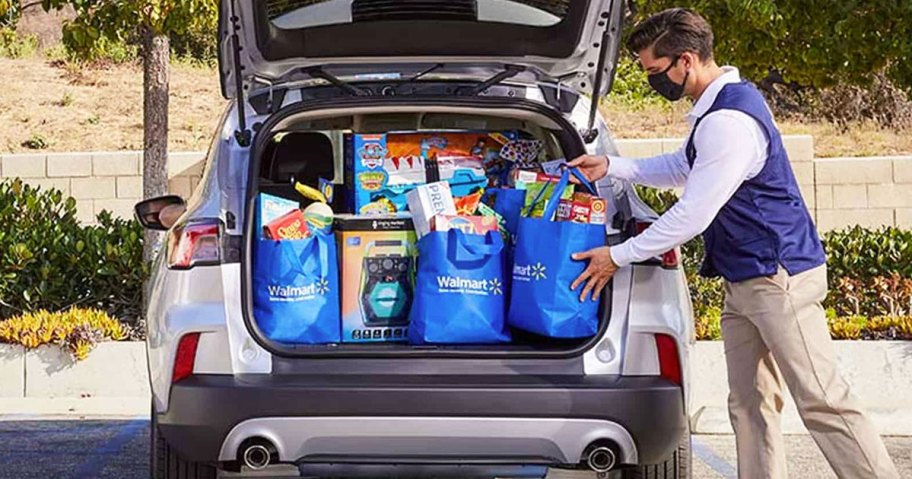 placing walmart groceries in back of car