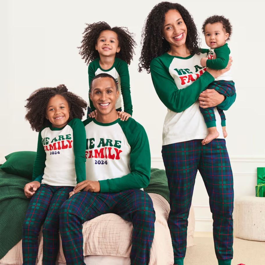 a family wearing matching christmas pajamas 