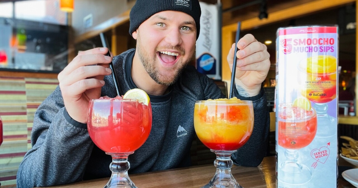 man with 2 frozen drinks at Applebees'