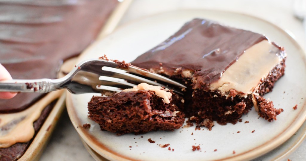 biting into a slice of cake