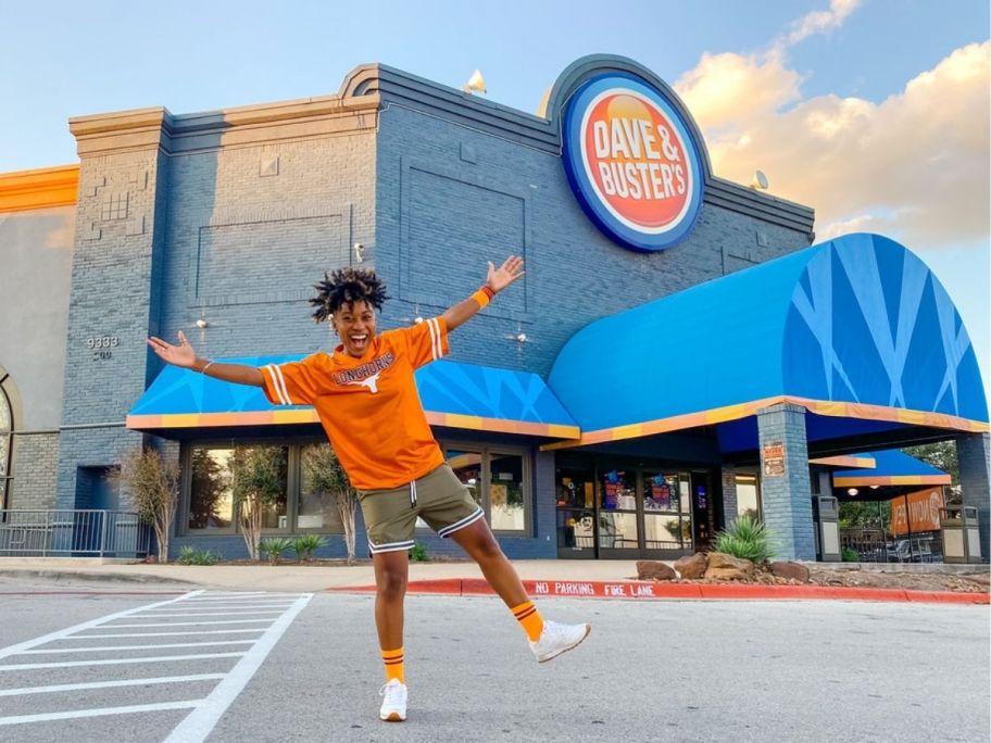 woman standing in front of Dave & Busters