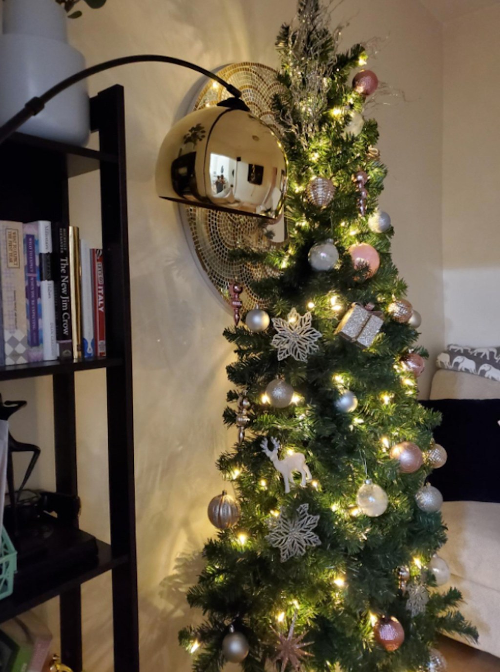 half of a christmas tree decorated with lights 