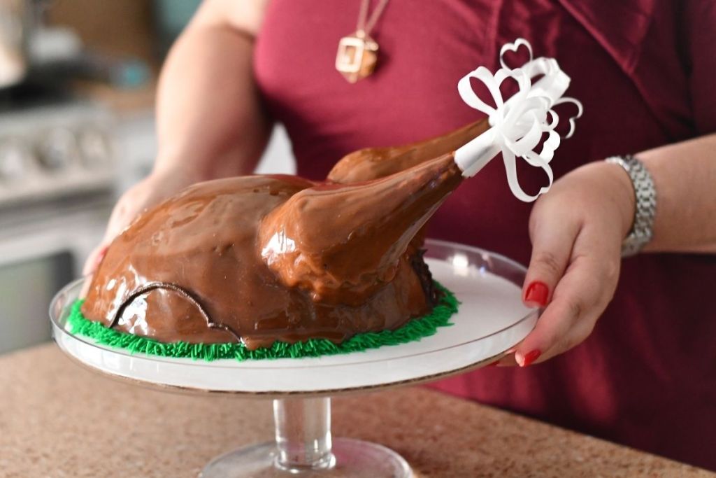 woman holding Baskin Robbins turkey cake