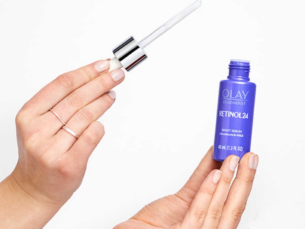 olay retinol serum in hands