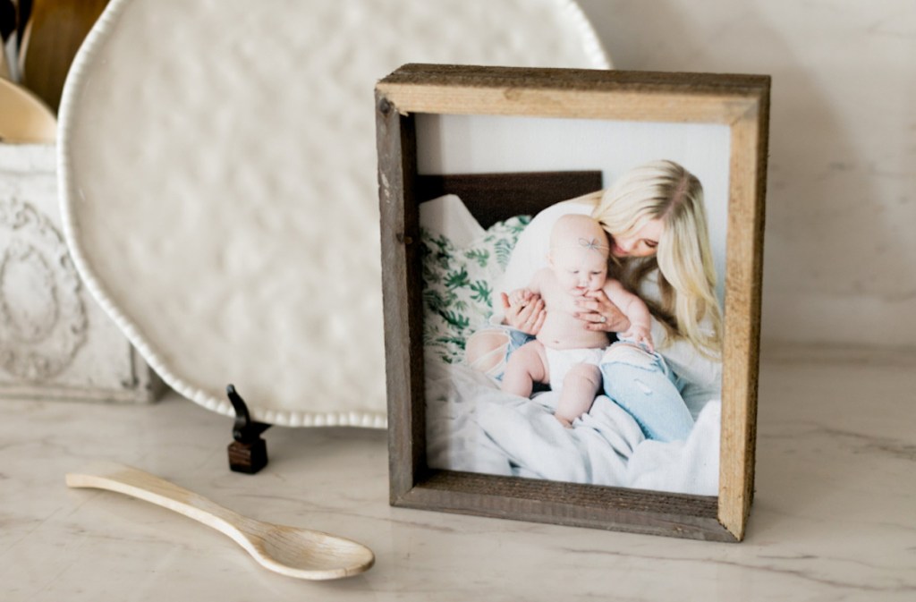 close up of wood framed picture on countertop