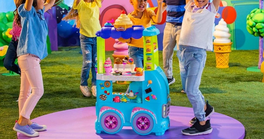 children playing with a Play Doh ice cream truck playset