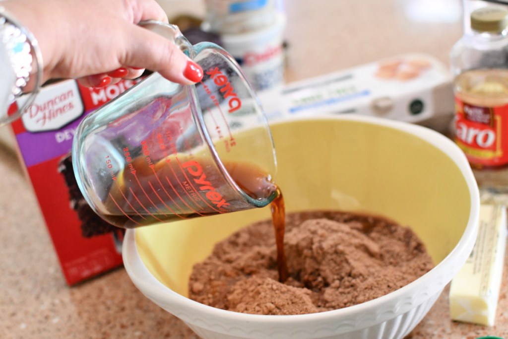 pouring coffee in a cake