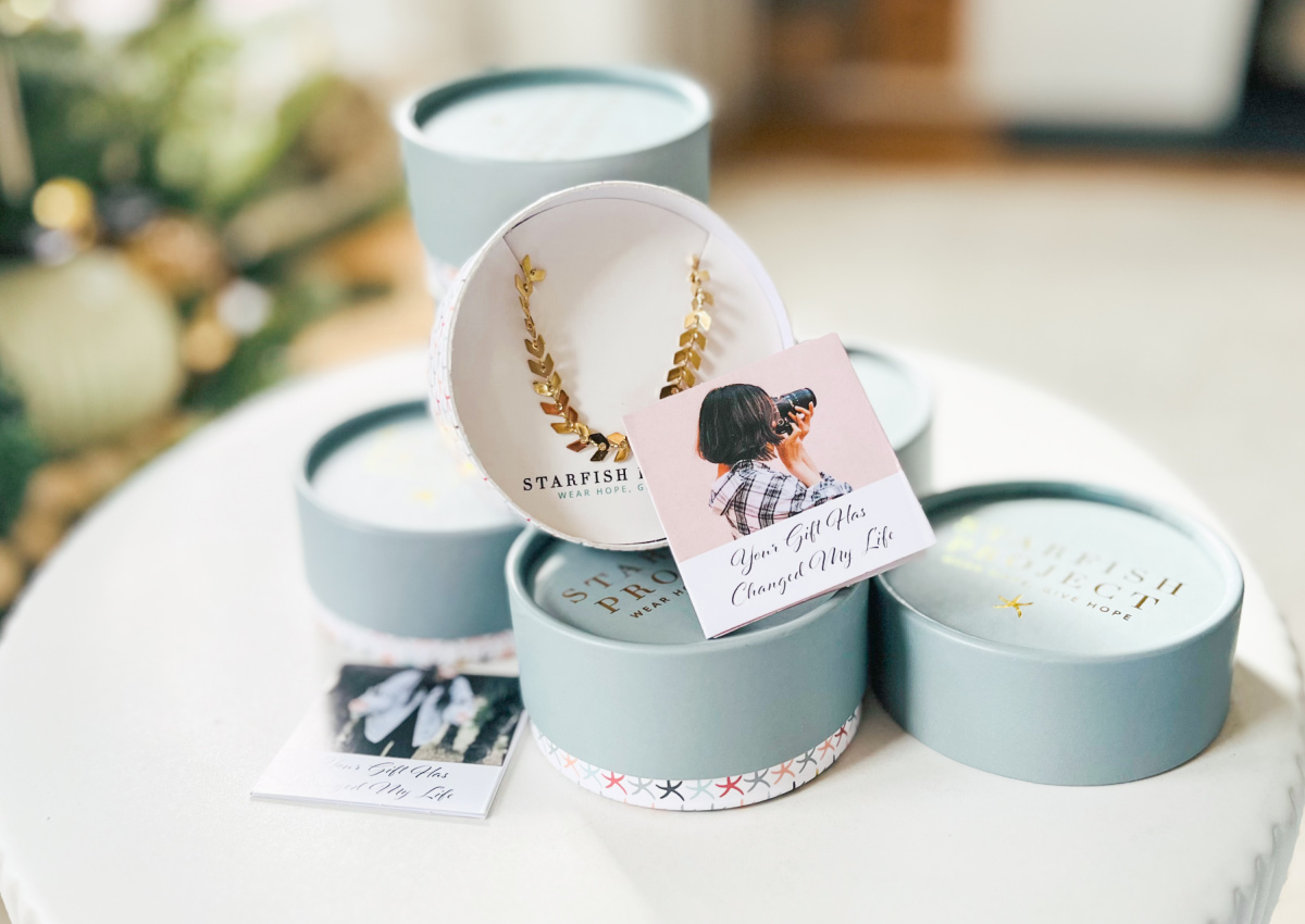 round jewelry box with bracelet and many boxes near christmas tree