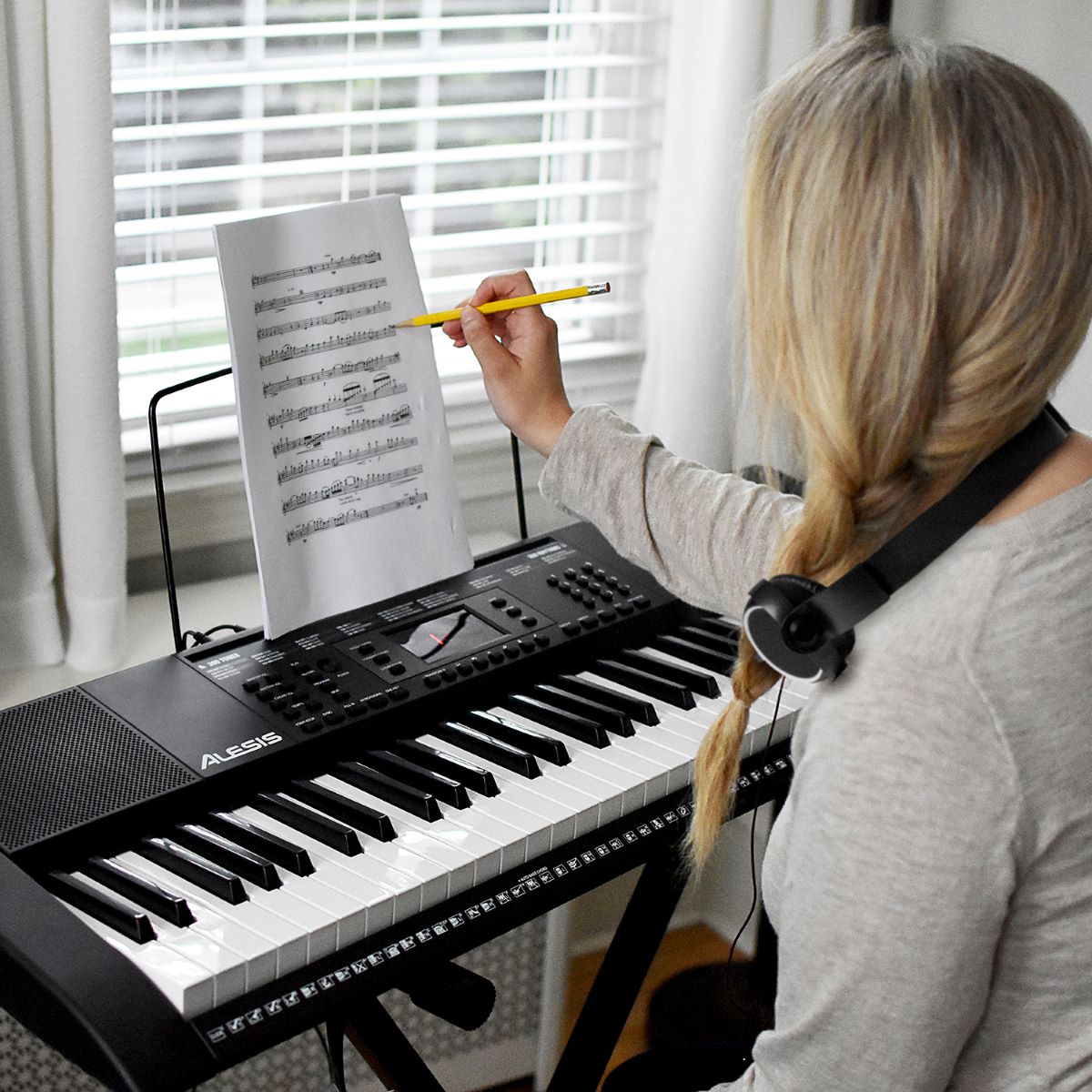 woman sitting at a keyboard