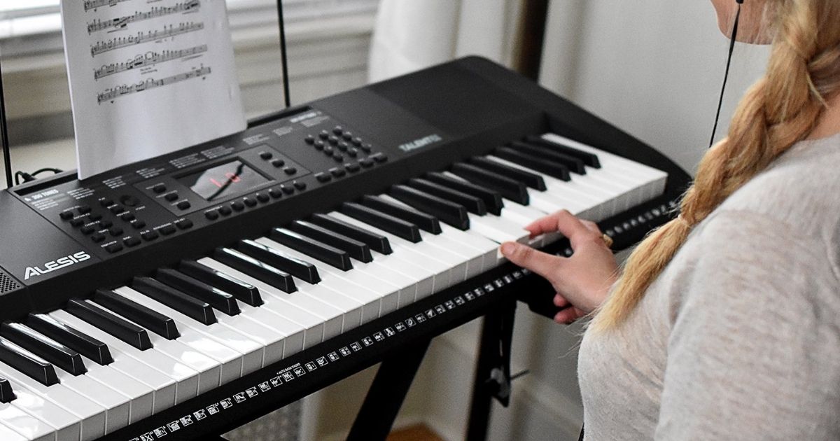 woman sitting at a keyboard