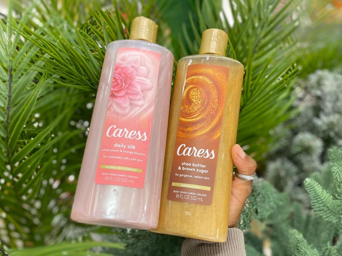 two bottles of caress body wash in store