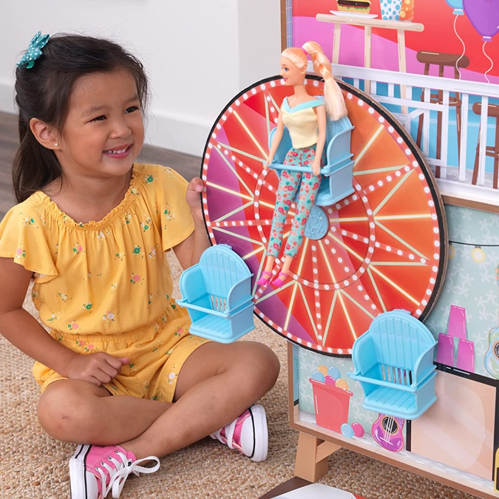 girl playing with a Kidkraft Beach House